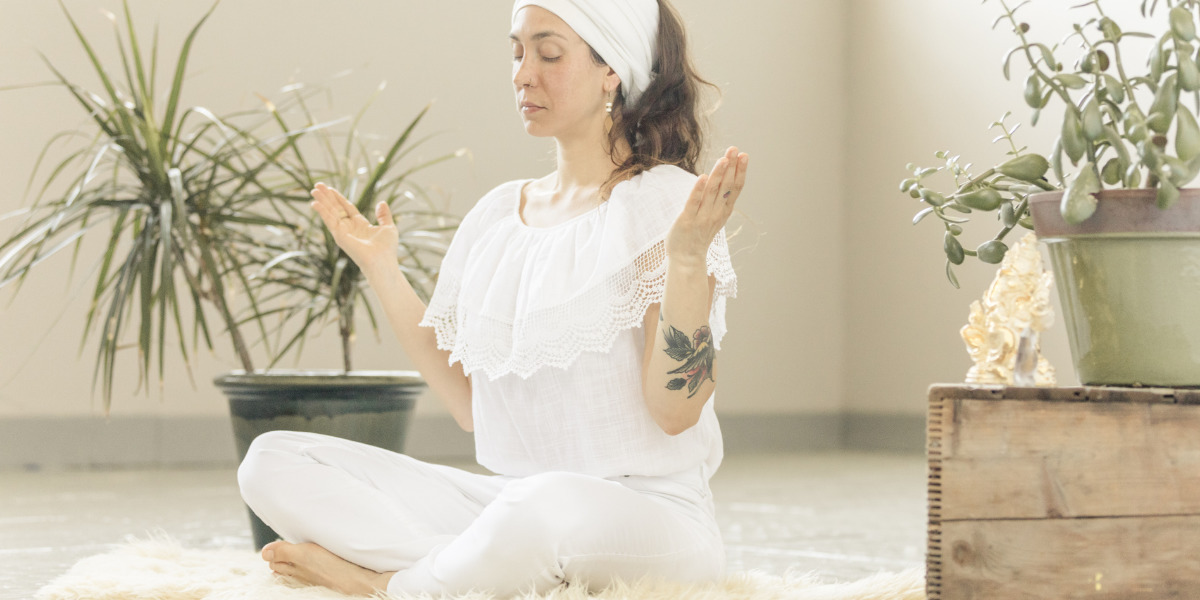 woman-sitting-in-lotus-pose